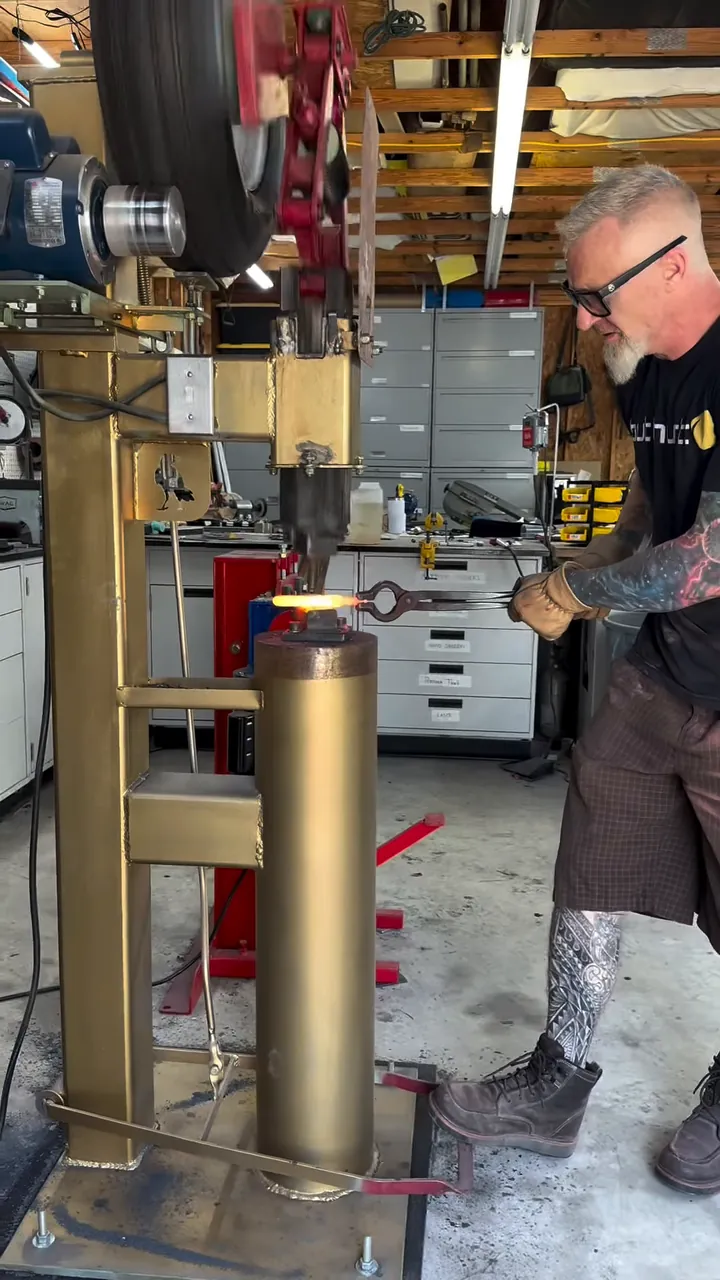 Josh Henry at the power hammer in his North Carolina shop
